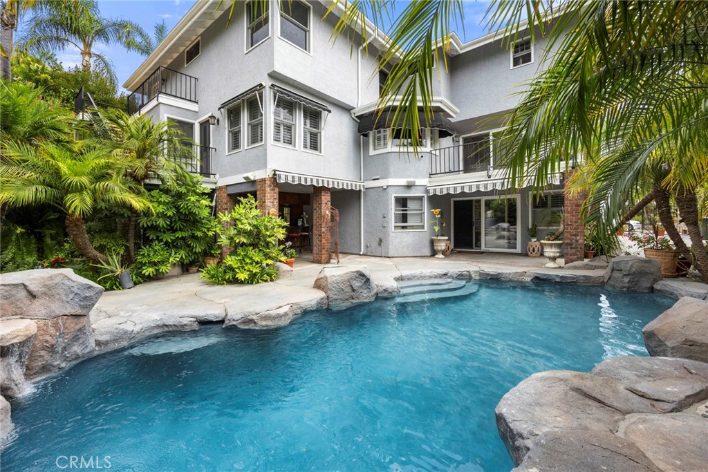 a house with river in front of it