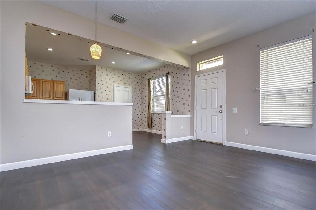 4744 Pond Ridge Drive Riverview, FL 33578 - Photo 11 of 18 a view of an empty room with wooden floor and a window