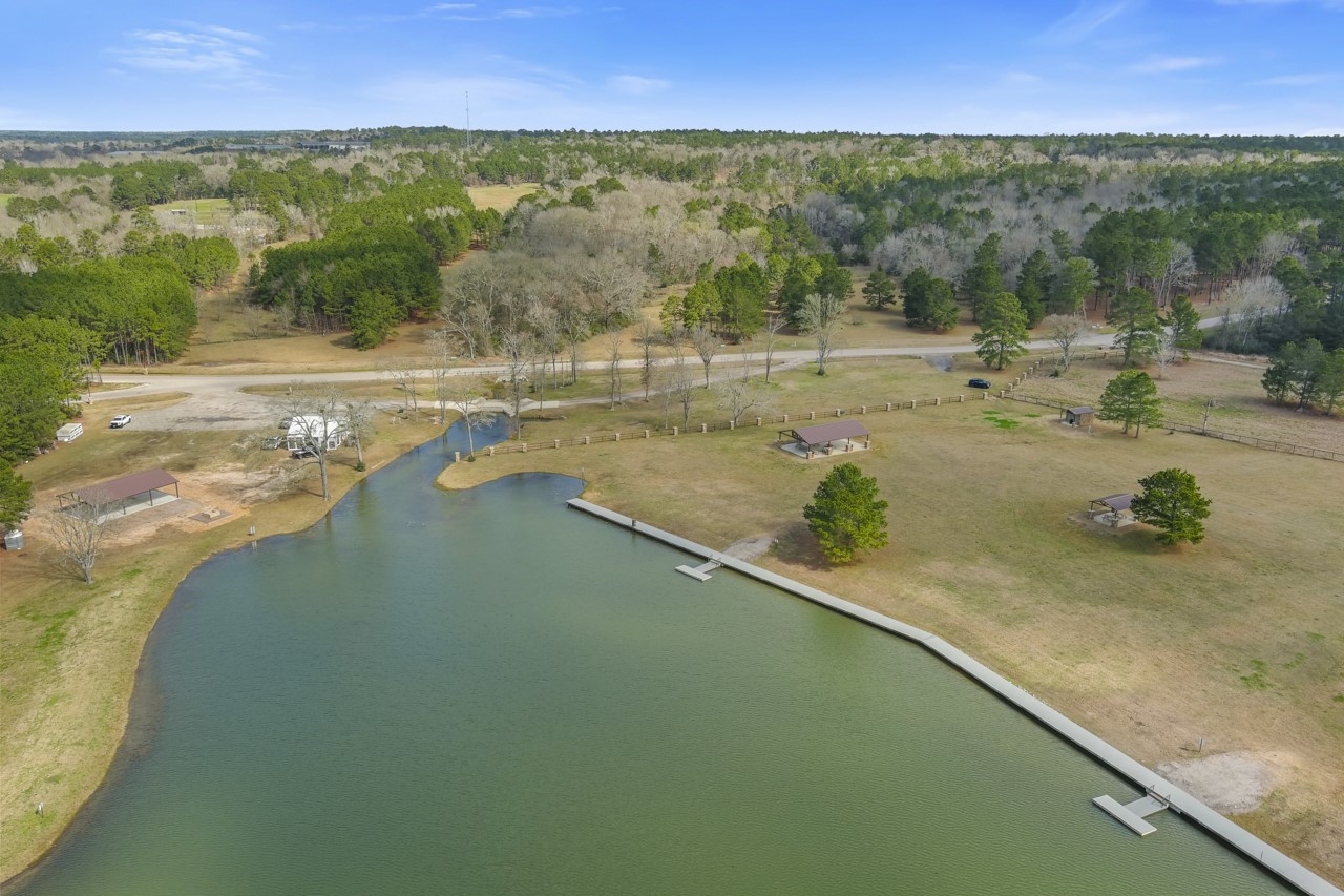 10751 Ruger Road Willis, TX 77378 - Photo 20 of 22 Spend your days fishing in this 7-acre stocked pond.