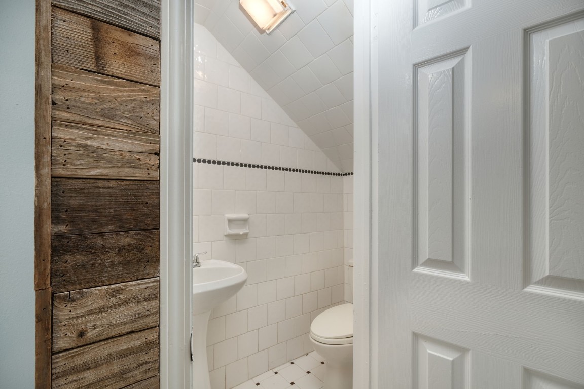 20500 Keilman Lane Pflugerville, TX 78660 - Photo 17 of 38 a bathroom with a granite countertop shower and a toilet
