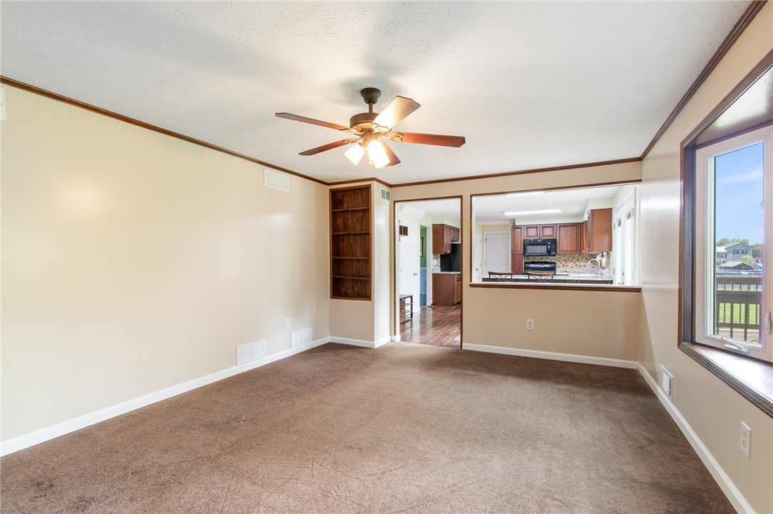 25 Spring Tree Lane Greece, NY 14612 - Photo 13 of 40 The family room view to the kitchen - the large wi