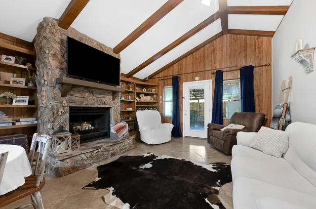 a living room with a couch and a bookshelf