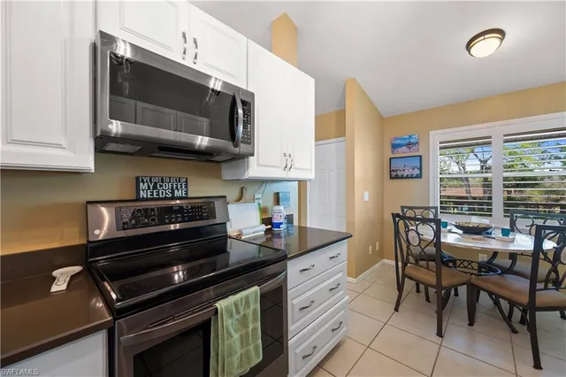 a kitchen with a stove and a microwave