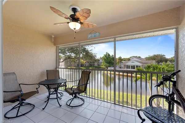 a view of a balcony with chairs