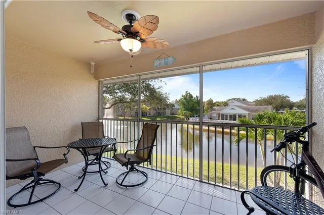 a view of a balcony with chairs