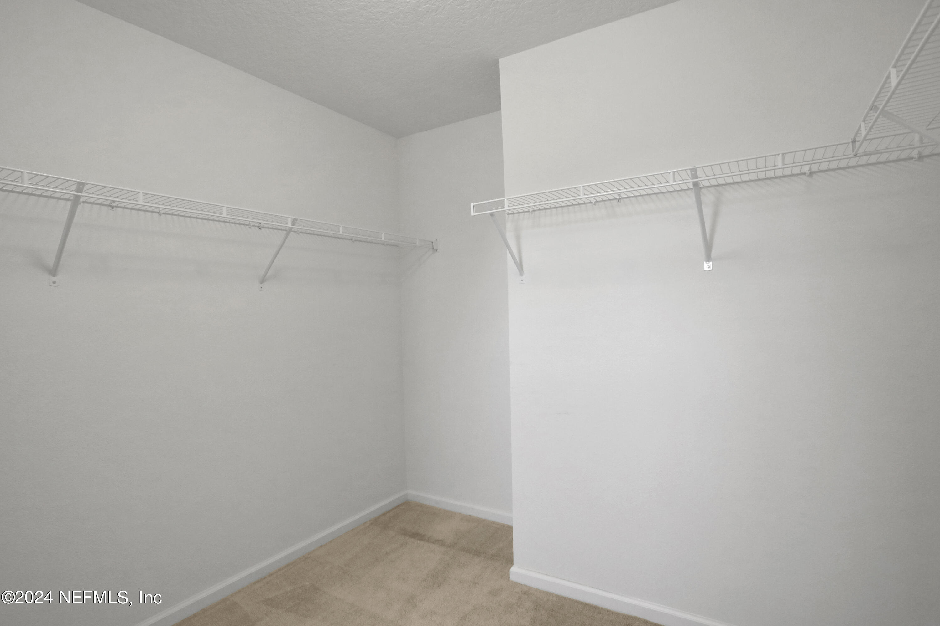 16055 Hutton Lane Jacksonville, FL 32218 - Photo 23 of 28 a view of a room with racks on the wall