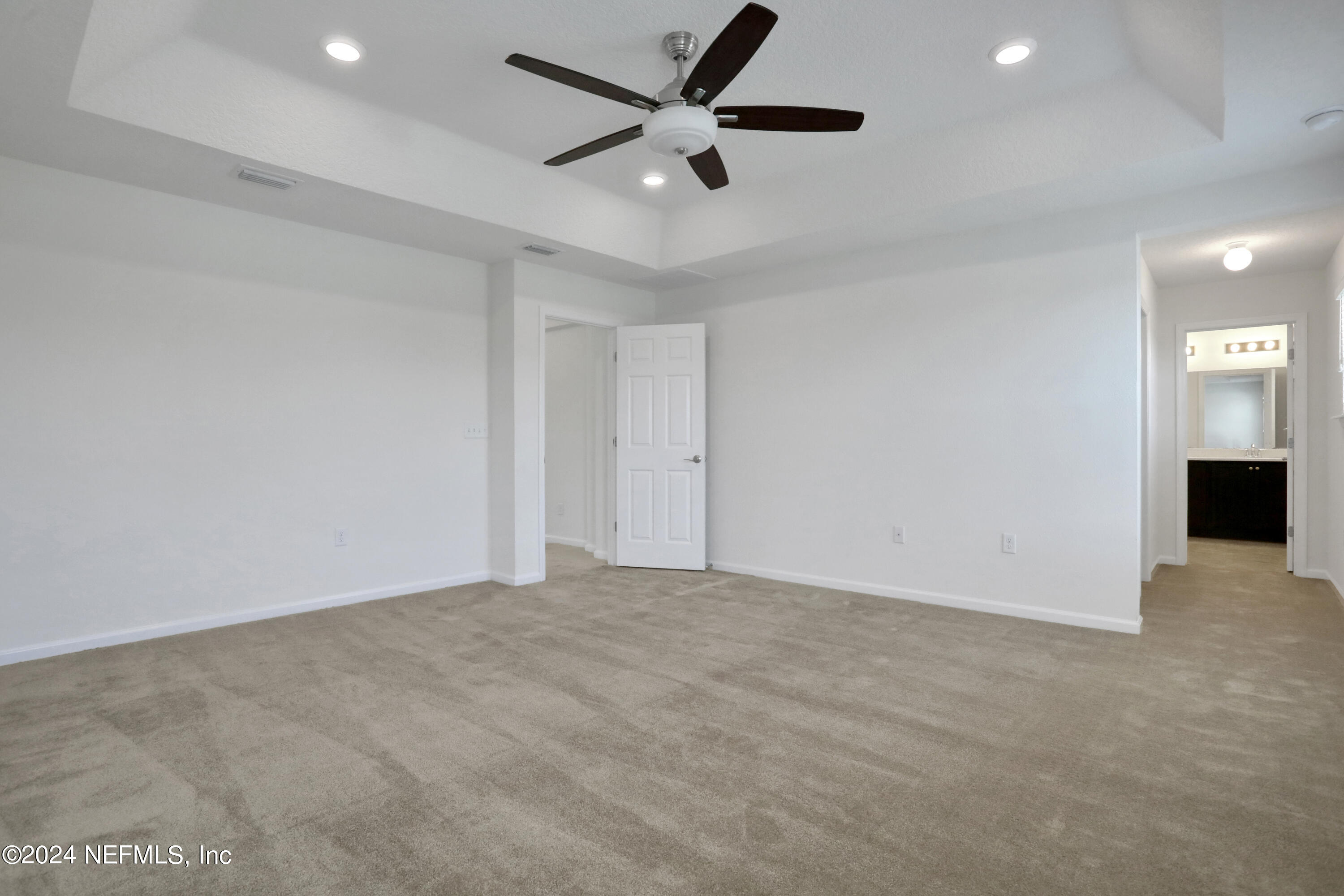 16055 Hutton Lane Jacksonville, FL 32218 - Photo 5 of 28 an empty room with closet and windows