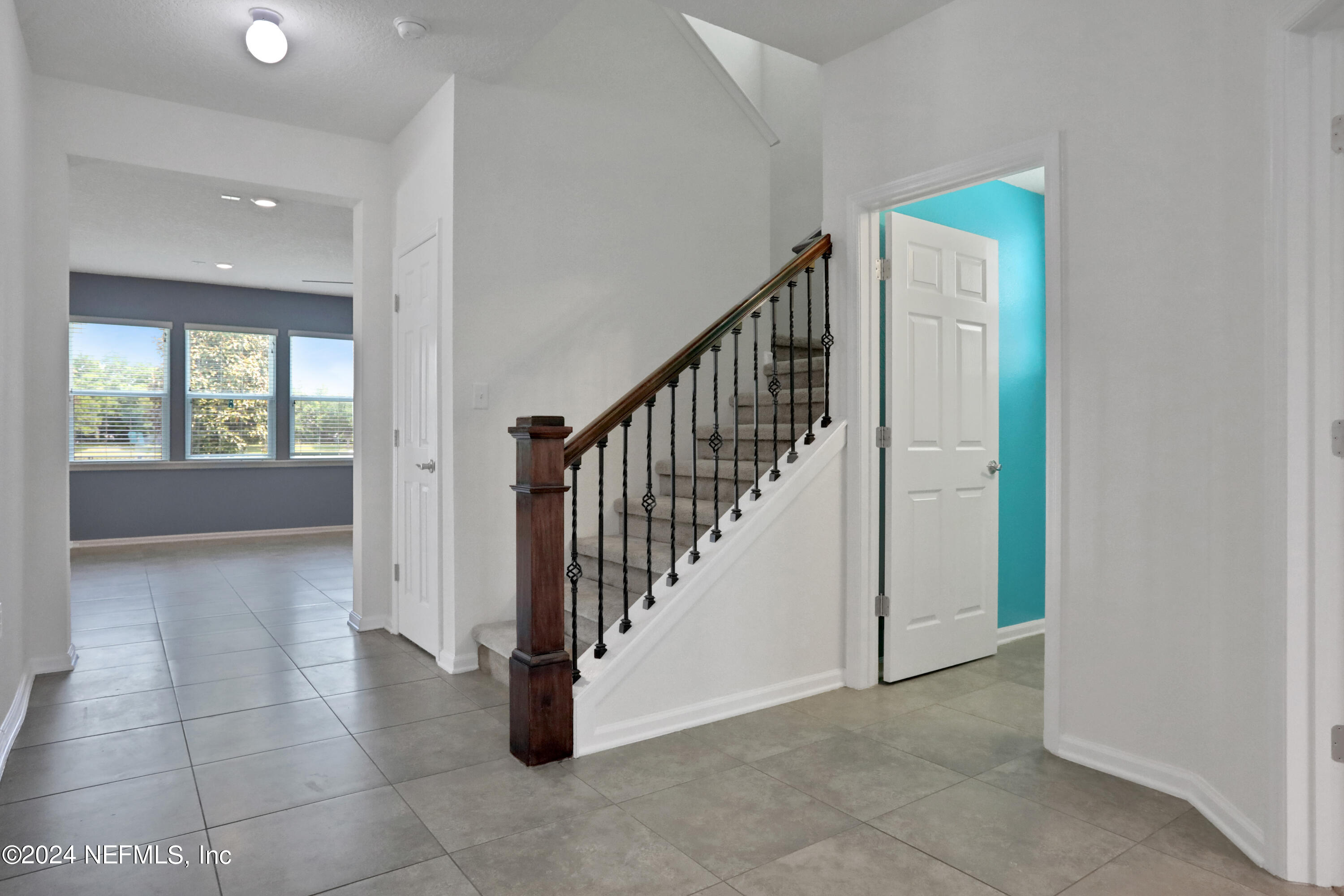 16055 Hutton Lane Jacksonville, FL 32218 - Photo 7 of 28 a view of an entryway with staircase