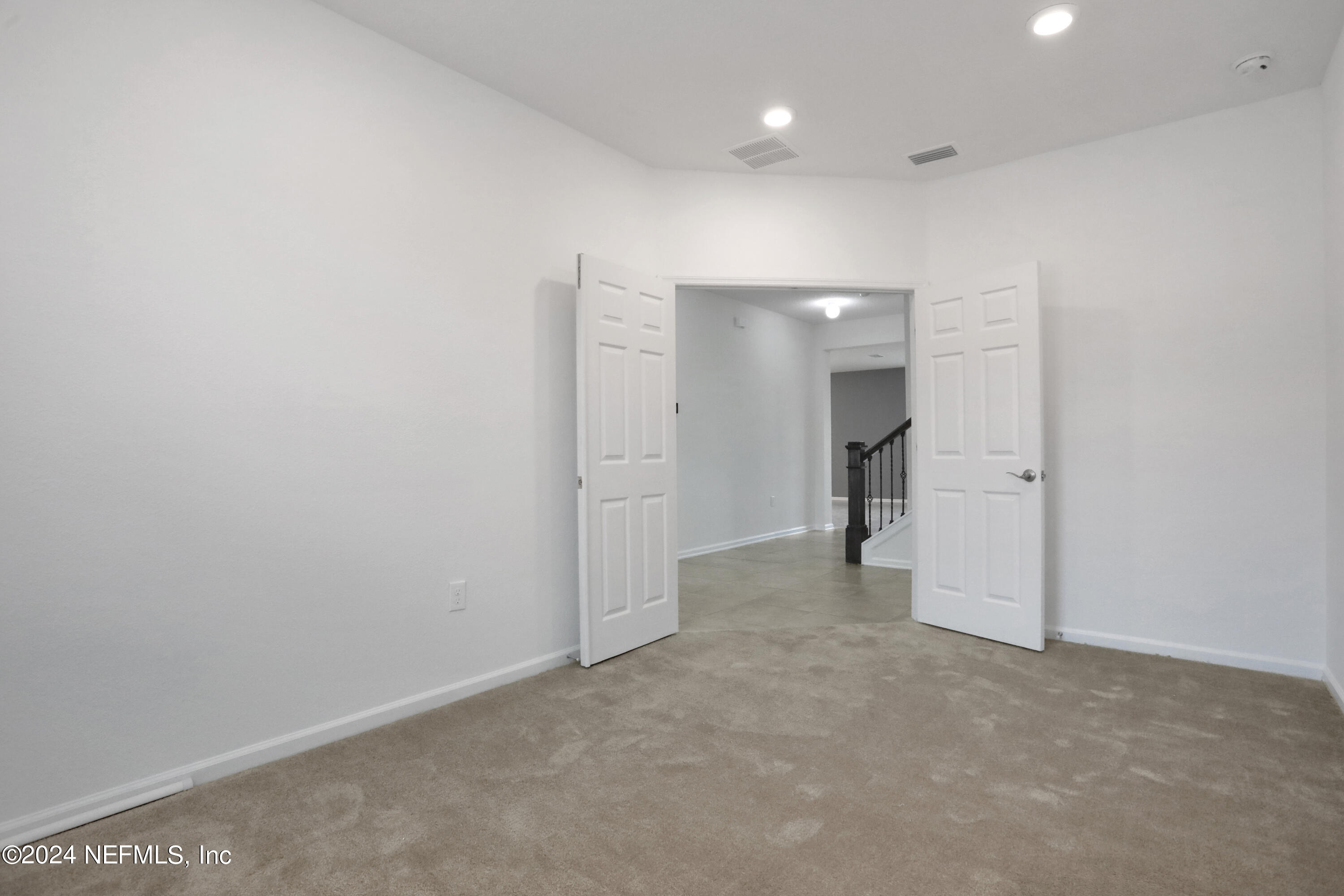 16055 Hutton Lane Jacksonville, FL 32218 - Photo 8 of 28 a view of a big room with a chandelier