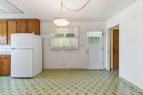 a kitchen with stainless steel appliances granite countertop a sink and a cabinets