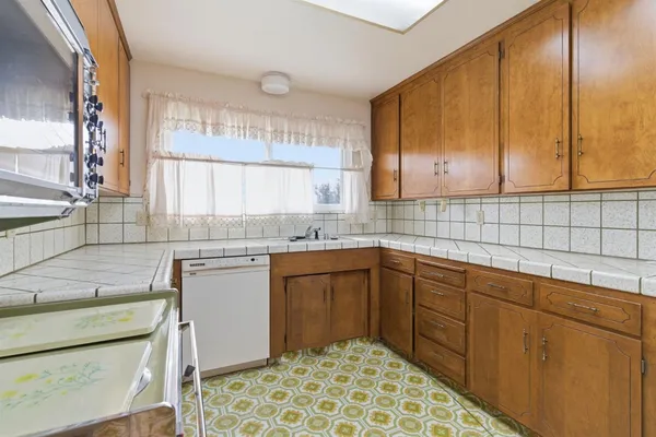 a kitchen with a stove and a sink