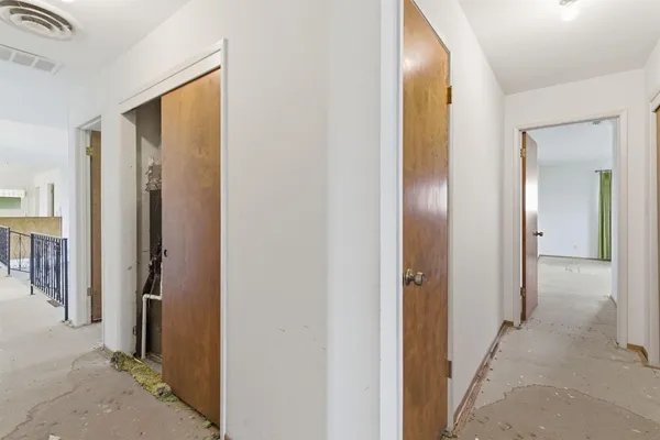 a view of a bathroom from a hallway