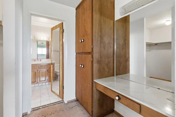 a view of empty room with wooden walls