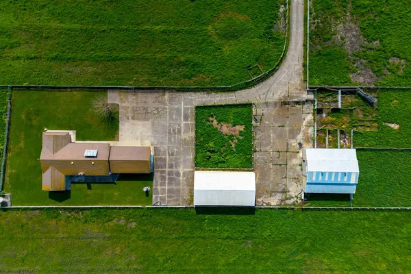 a view of a house with a backyard