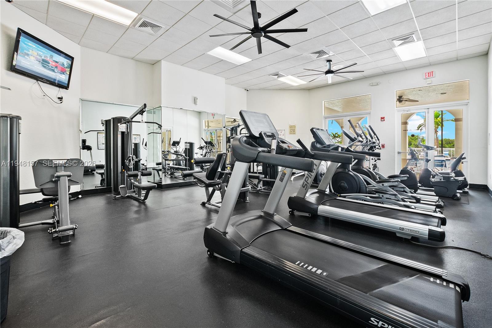 3363 Southwest 169th Terrace Miramar, FL 33027 - Photo 18 of 21 a view of a room with gym equipment