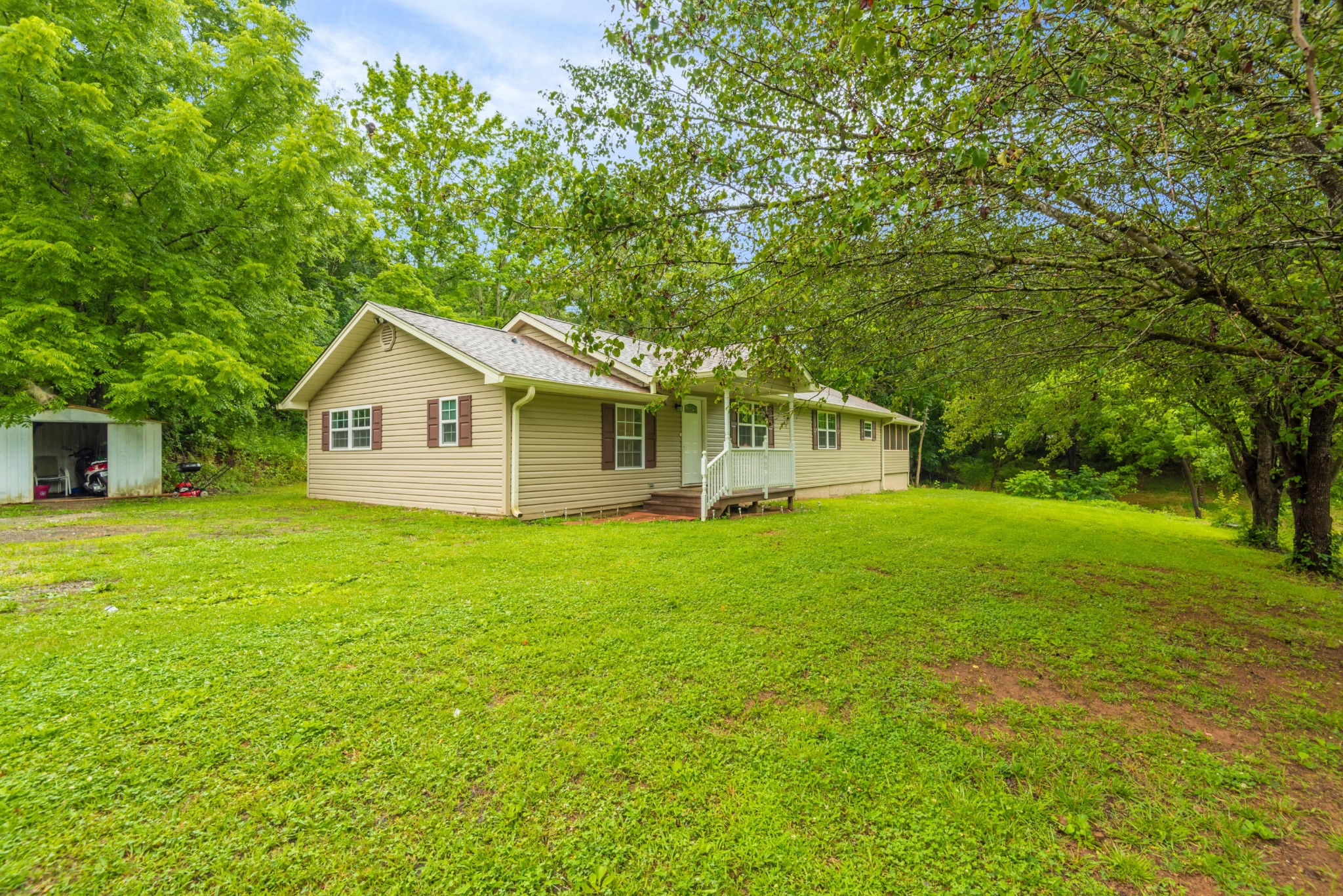 649 Johnson Road Kodak, TN 37764 - Photo 3 of 27 a view of a backyard with large trees