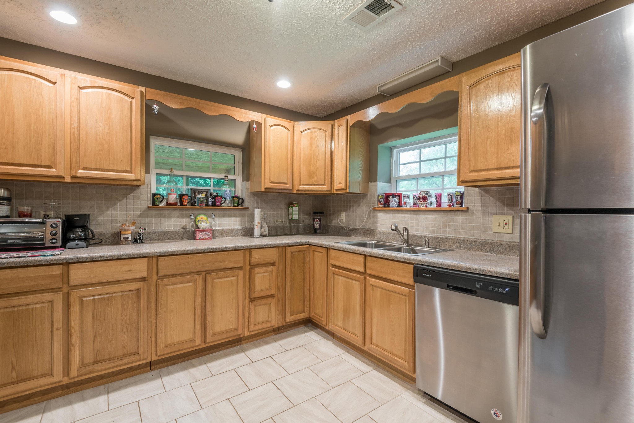 649 Johnson Road Kodak, TN 37764 - Photo 10 of 27 a kitchen with stainless steel appliances granite countertop a sink and cabinets