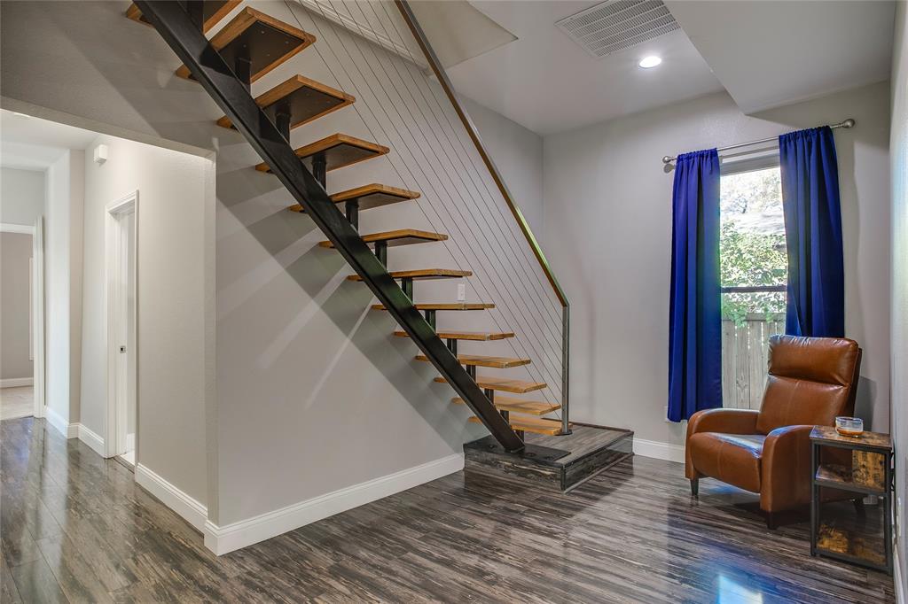 834 South Polk Street Dallas, TX 75208 - Photo 23 of 38 a livingroom with wooden floor and stairs