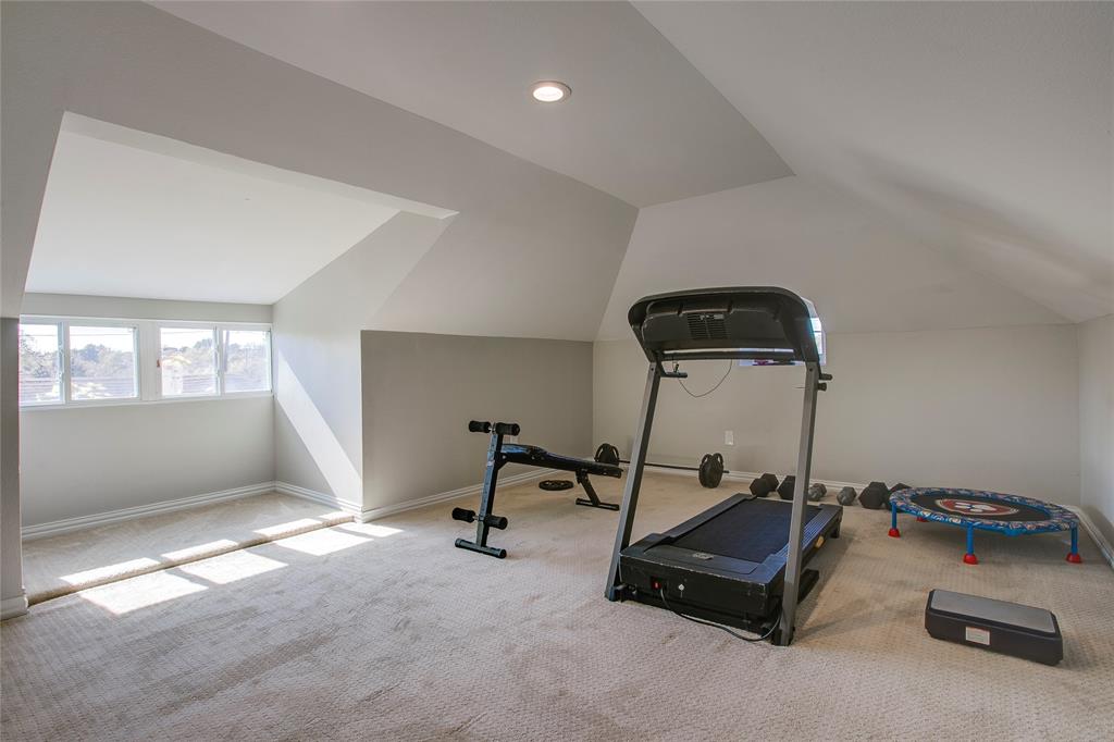 834 South Polk Street Dallas, TX 75208 - Photo 31 of 38 a room with gym equipment and a window