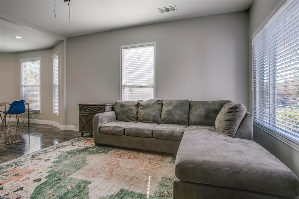 834 South Polk Street Dallas, TX 75208 - Photo 5 of 38 a living room with furniture and a large window