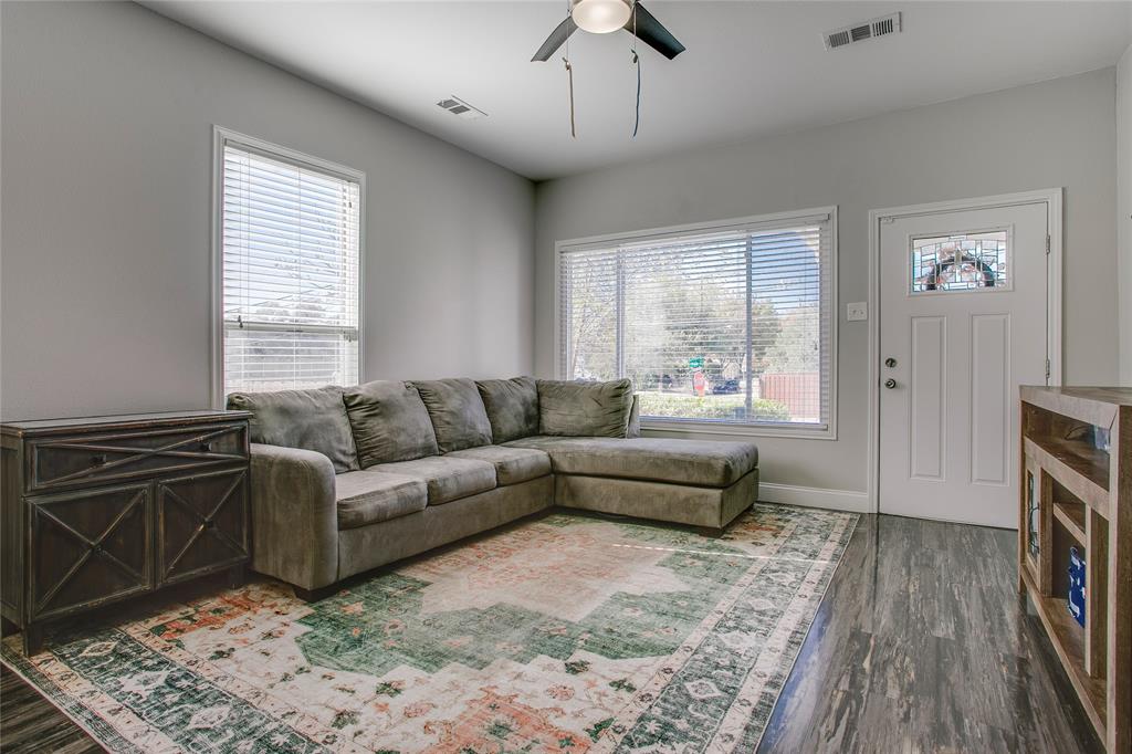 834 South Polk Street Dallas, TX 75208 - Photo 6 of 38 a living room with furniture and wooden floor