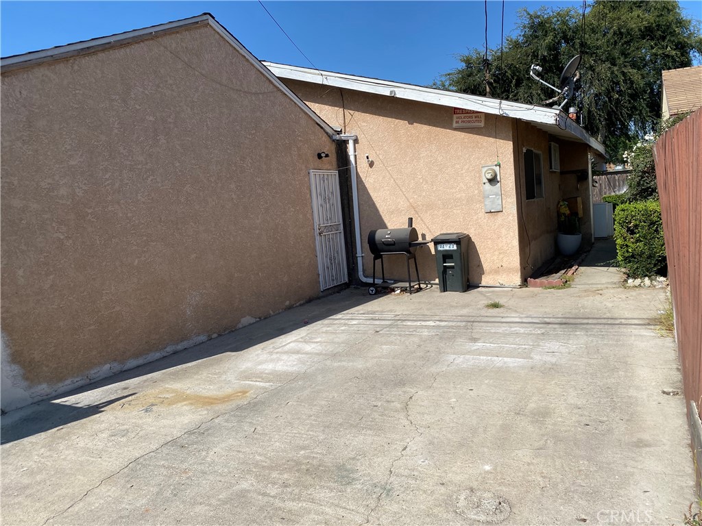 5846 Gardenia Avenue Long Beach, CA 90805 - Photo 17 of 26 a view of a white house with a outdoor space