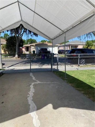 a view of an chairs and table in the patio