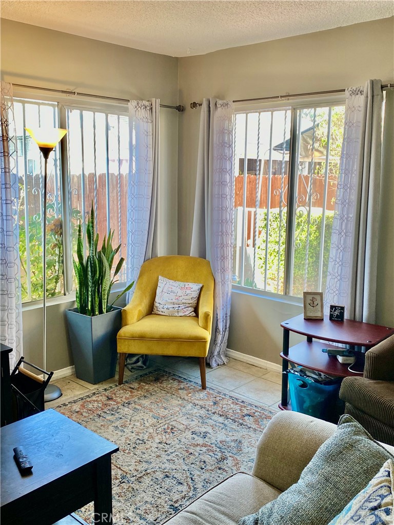5846 Gardenia Avenue Long Beach, CA 90805 - Photo 5 of 26 a living room with furniture and a potted plant