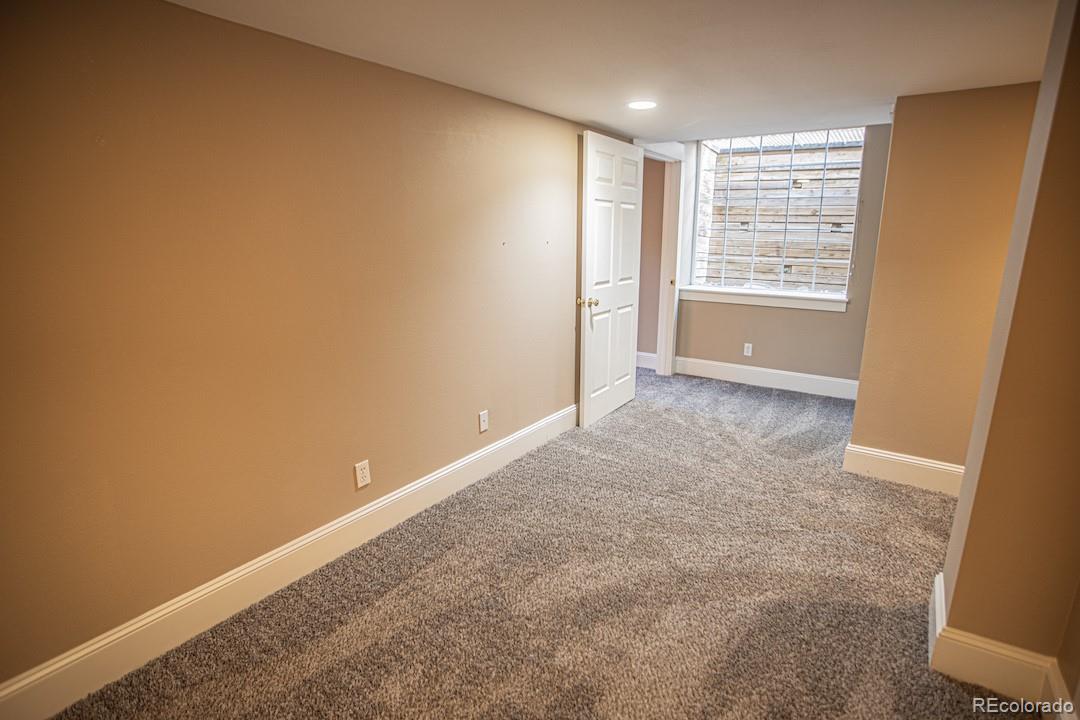 710 East Baseline Road Lafayette, CO 80026 - Photo 19 of 33 an empty room with windows