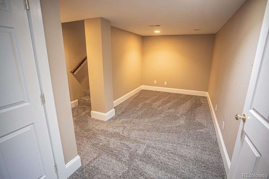710 East Baseline Road Lafayette, CO 80026 - Photo 26 of 33 an empty room with wooden floor