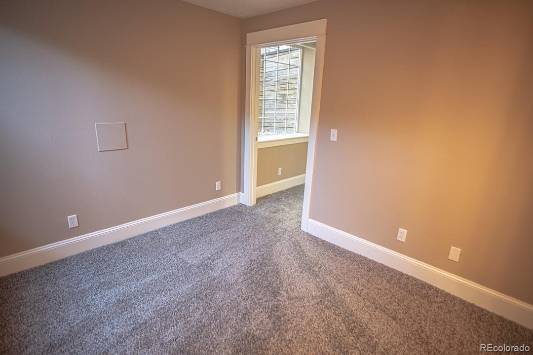 710 East Baseline Road Lafayette, CO 80026 - Photo 28 of 33 an empty room with windows