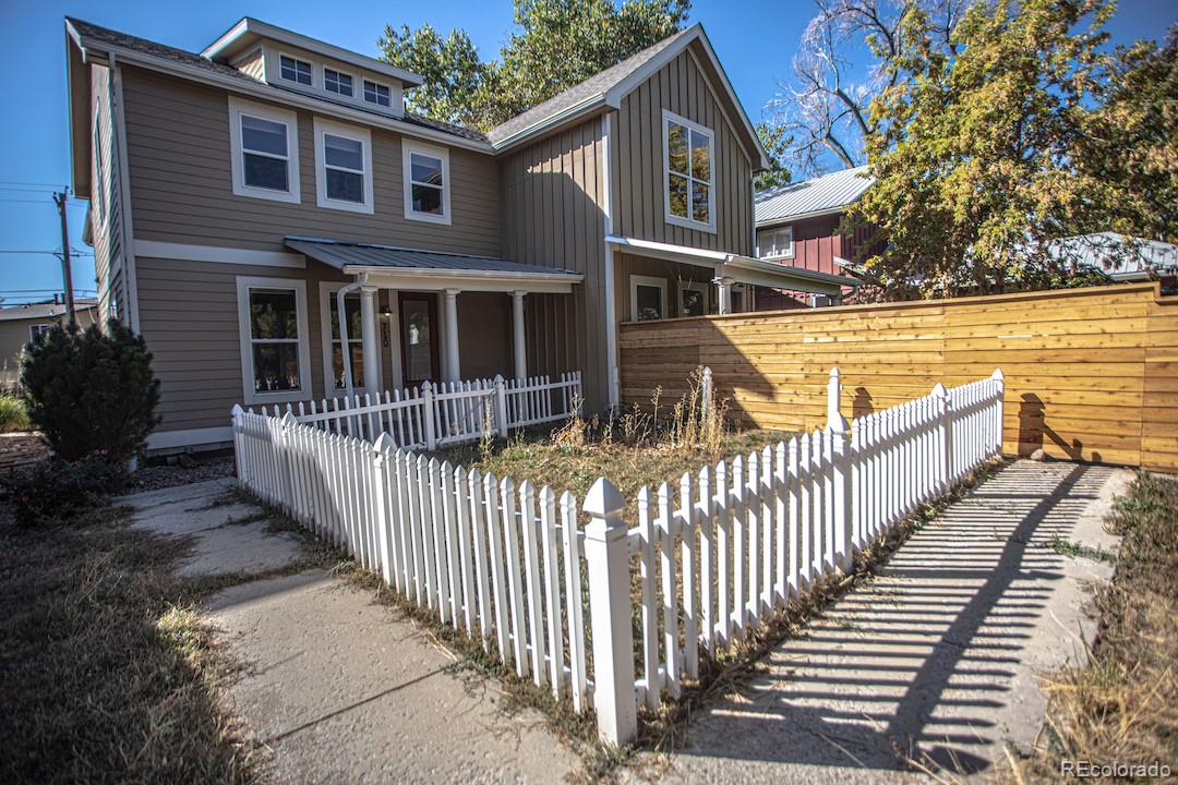 710 East Baseline Road Lafayette, CO 80026 - Photo 3 of 33 a view of a house with wooden fence and a porch