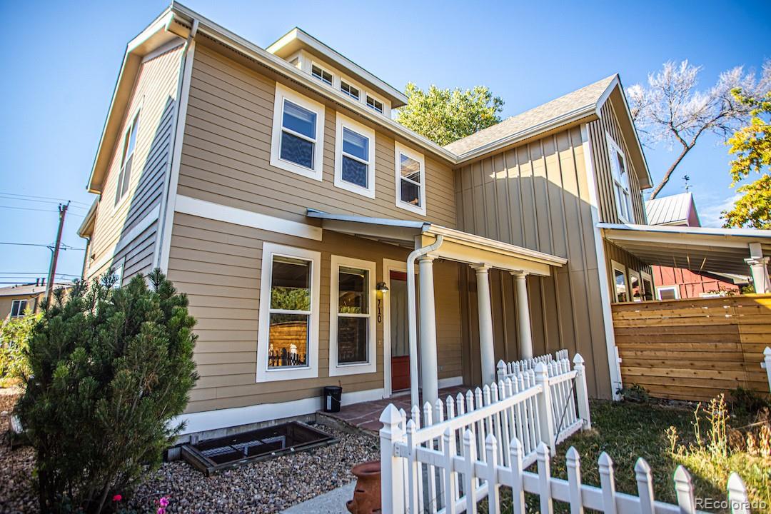 710 East Baseline Road Lafayette, CO 80026 - Photo 4 of 33 a front view of a house with a porch