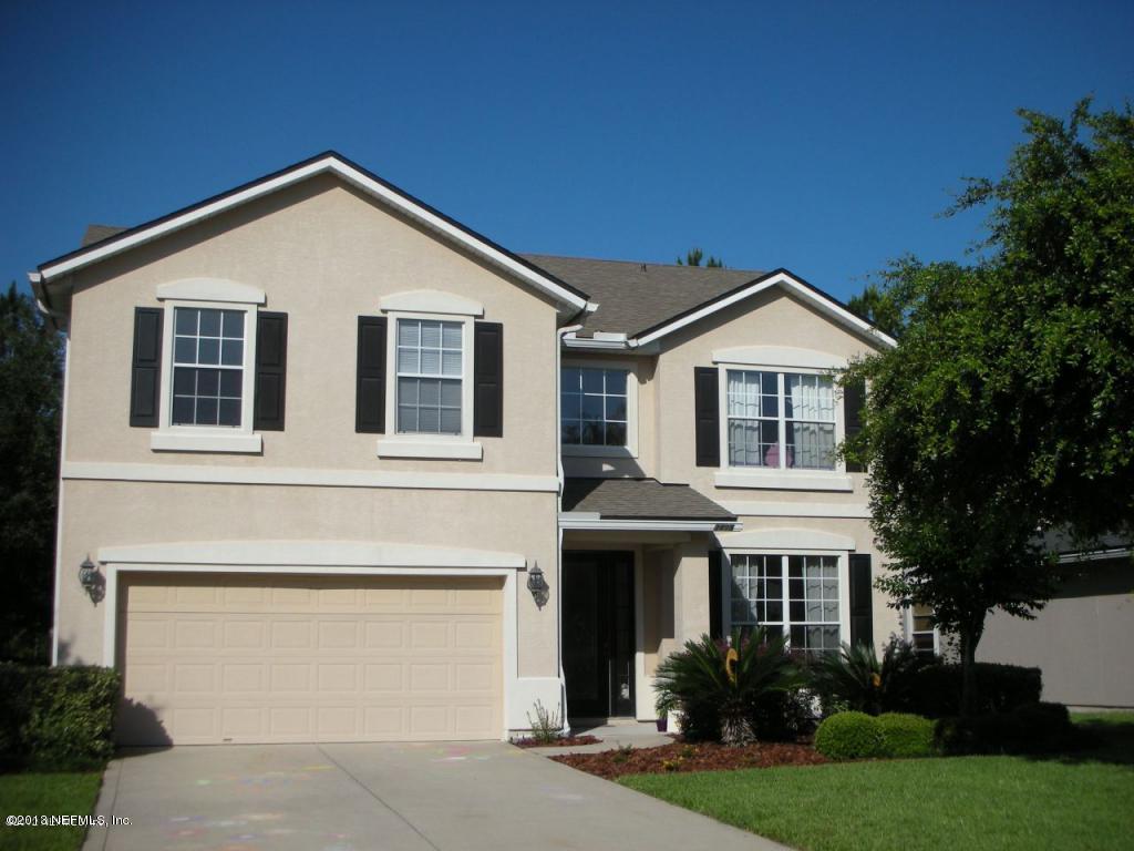 3409 South Saxxon Road St. Augustine, FL 32092 - Photo 1 of 15 a front view of a house with garden
