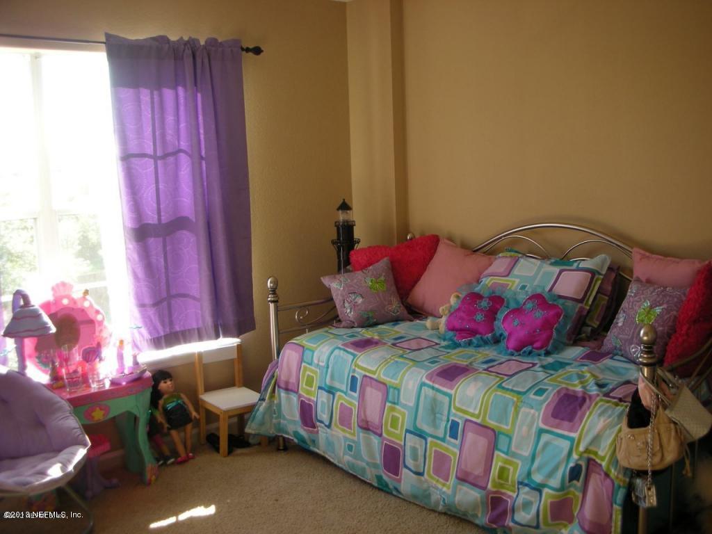 3409 South Saxxon Road St. Augustine, FL 32092 - Photo 12 of 15 a bedroom with a bed and a window