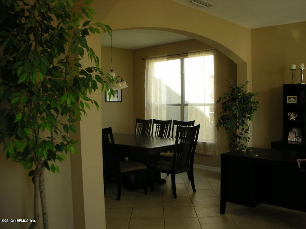 3409 South Saxxon Road St. Augustine, FL 32092 - Photo 7 of 15 a dining room with furniture and window