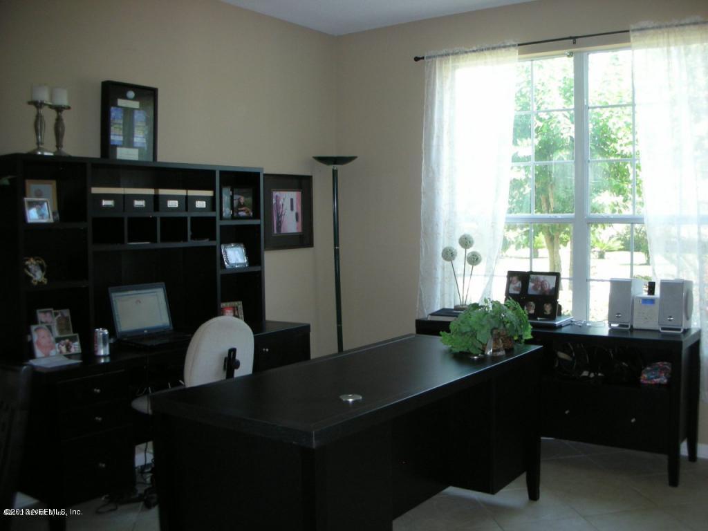 3409 South Saxxon Road St. Augustine, FL 32092 - Photo 8 of 15 a living room with furniture lamp and window