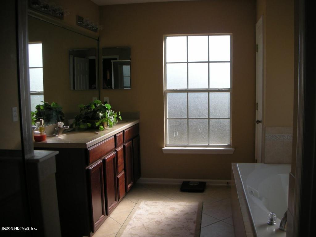 3409 South Saxxon Road St. Augustine, FL 32092 - Photo 10 of 15 a kitchen with a window and a sink