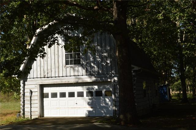 517 Second Plumb Road Belvidere, TN 37306 - Photo 18 of 20 a view of a white house with a tree in front of it