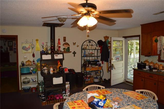 517 Second Plumb Road Belvidere, TN 37306 - Photo 6 of 20 a bedroom with a bed and a chandelier