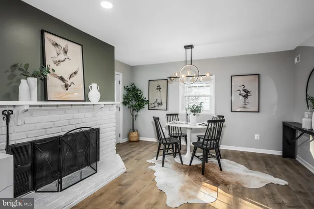 a view of a livingroom with furniture window and fireplace
