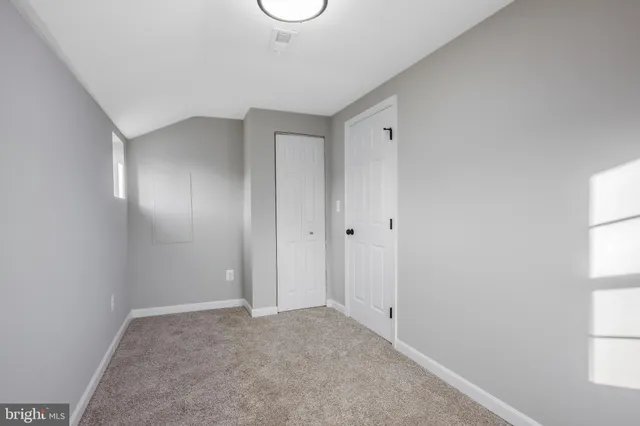 a view of hallway with windows