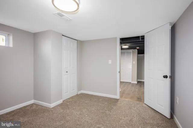 a view of an empty room and window