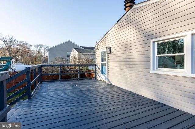 a view of a house with wooden deck