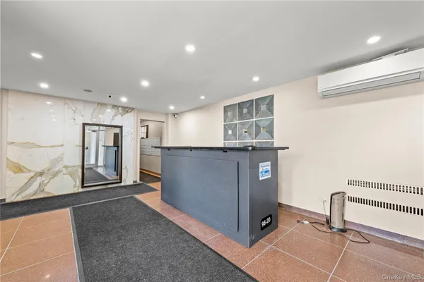 a view of a kitchen with fridge and wooden floor