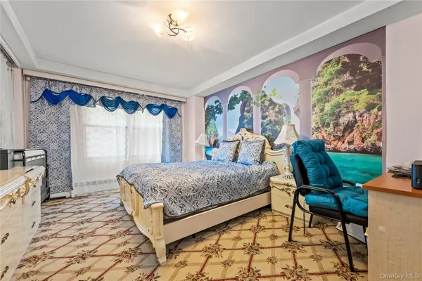 a living room with a bed furniture and a large window