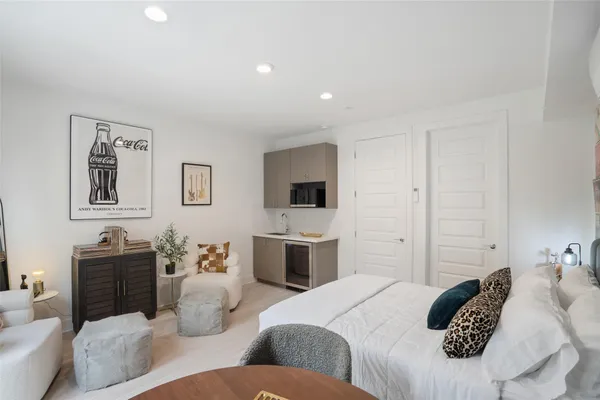 a bedroom with a bed and furniture