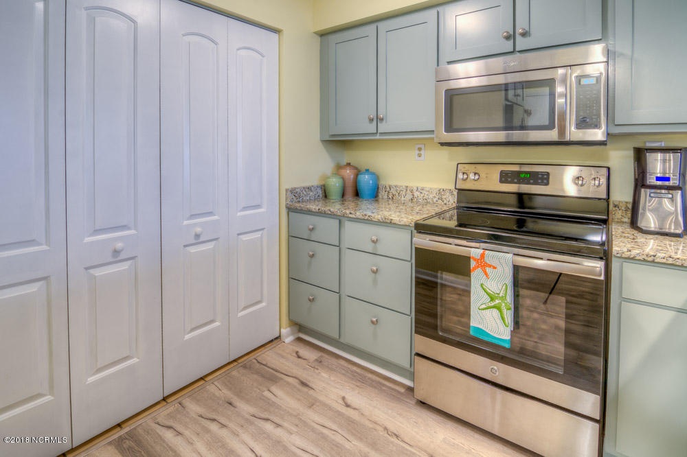 1505 Salter Path Road, Unit 223 Indian Beach, NC 28512 - Photo 17 of 47 Washer and Dryer behind Doors