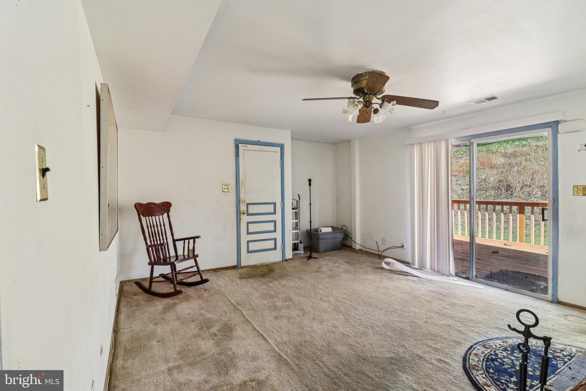 1916 Taylor Avenue Fort Washington, MD 20744 - Photo 20 of 64 a view of a livingroom with a chair and potted plant
