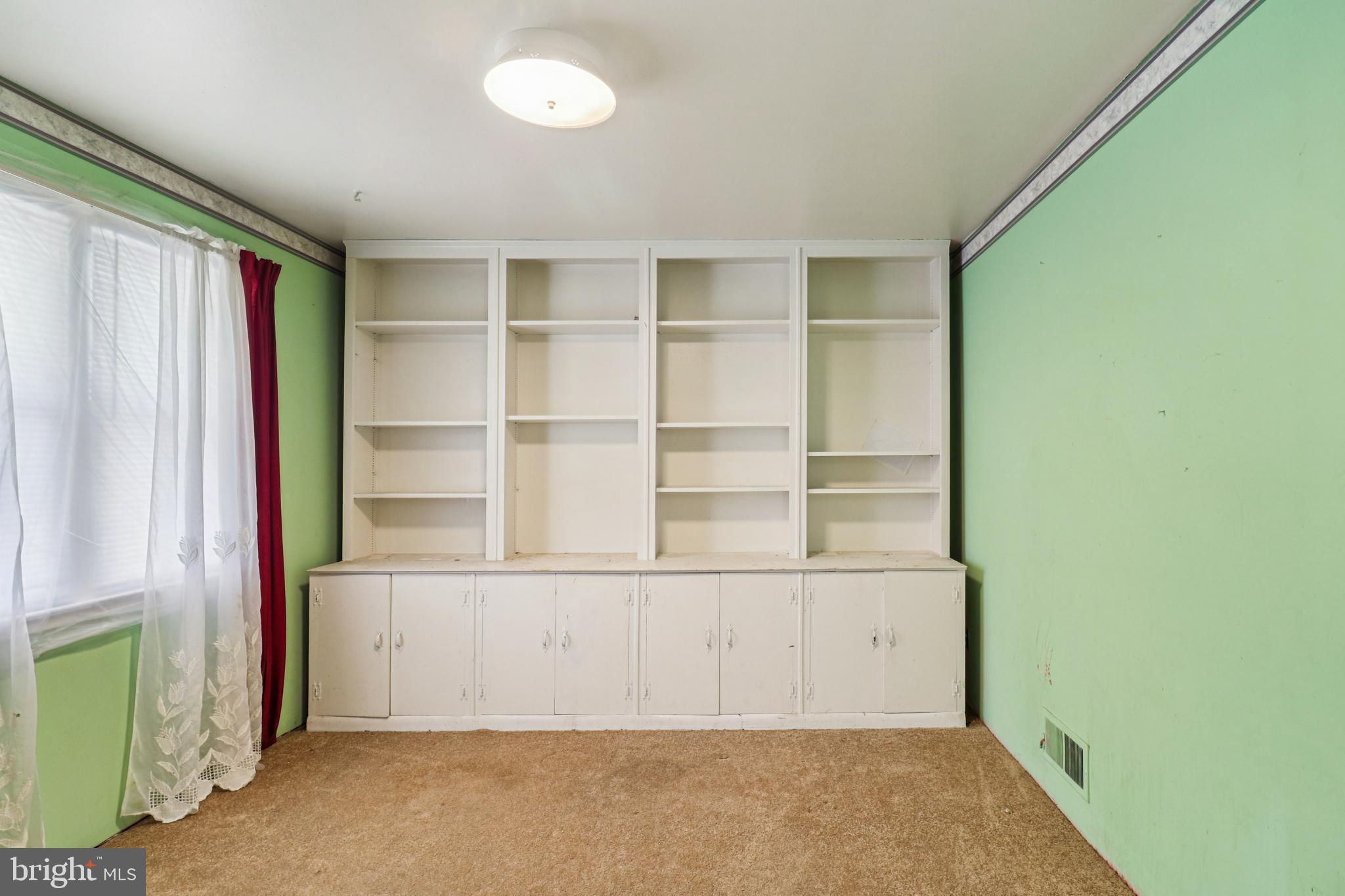 1916 Taylor Avenue Fort Washington, MD 20744 - Photo 25 of 64 a view of a room with rack on the wall and a window